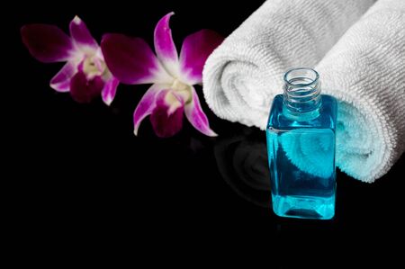 Essential oil and white towel with  orchid ,set for SPAの写真素材