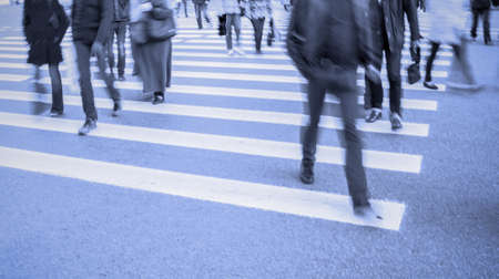 blue color blur people leg walking on crosswalkの写真素材