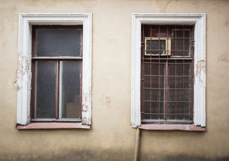 old two window and ancient cement  wallの写真素材