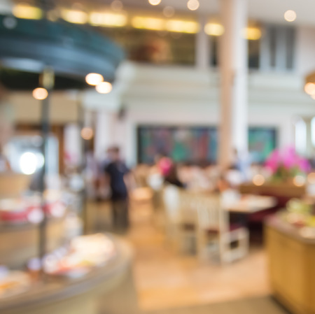 blur people  sitting on seat in dining room with bokehの写真素材