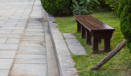wooden bench in park on yard relaxation sceneの写真素材