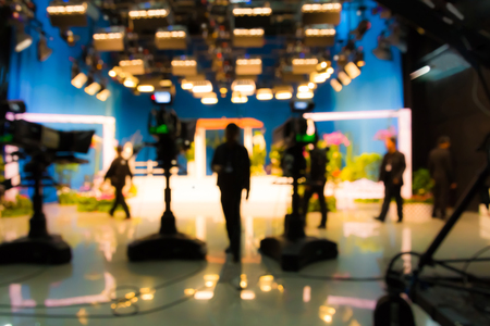blurred silhouette cameraman with  staff in TV studio stationの写真素材
