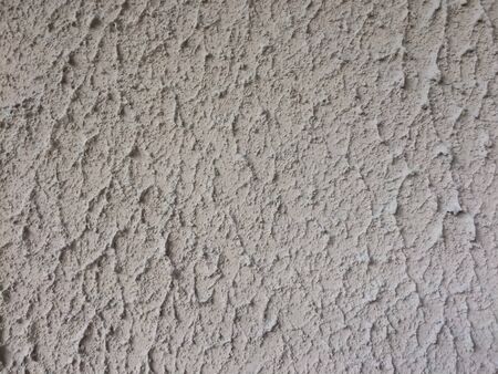 Rough plaster wall, rough concrete pattern as a background.の素材