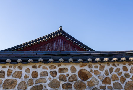 Traditional korea house roof with blue sky background, closeup of photoの写真素材