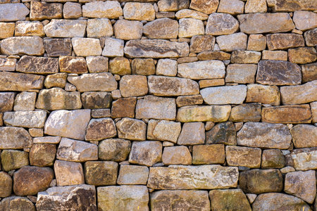 Background of stone wall texture. Close-up of stone wall.の写真素材