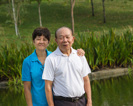 Chinese Asian senior couple at the parkの写真素材