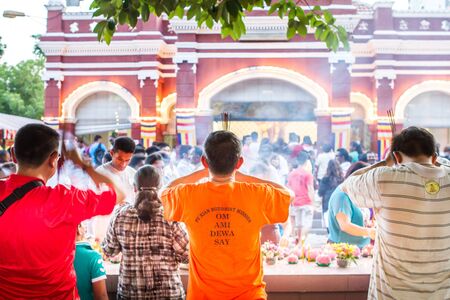 Kuala Lumpur, Malaysia- Buddhist devotees celebrating Wesak Day at the Maha Vihara Buddhist Temple,...