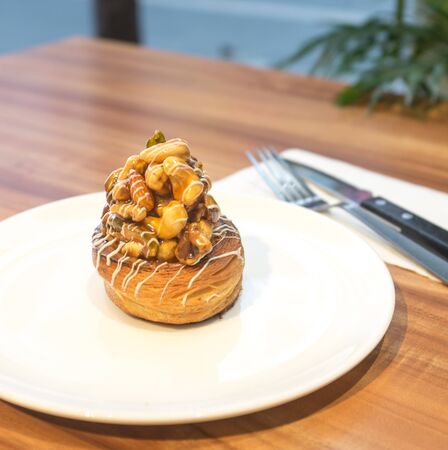 Mixed Nuts Croissant on white plateの写真素材
