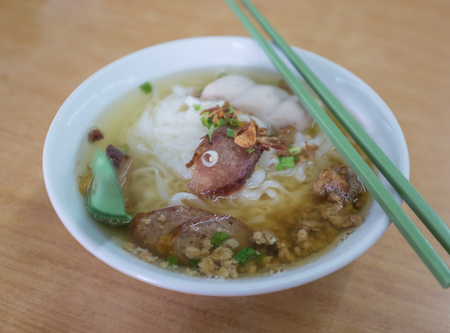 Pork noodles soup with chopsticks