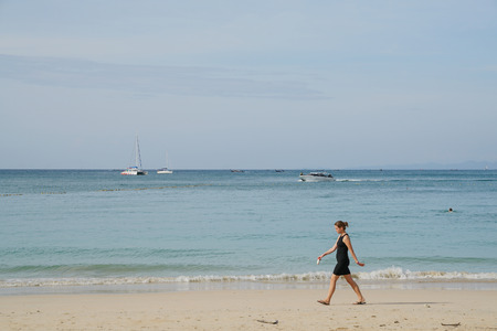 Railay Beach, Krabi, Thailand, 1st January 2019: Morning scene with long tail boats and tourists at lovely Railay beach.のeditorial素材