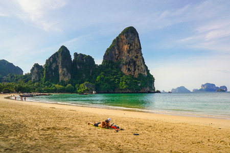 Railay Beach, Krabi, Thailand, 1st January 2019: Morning scene with long tail boats and tourists at lovely Railay beach.のeditorial素材