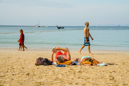 Railay Beach, Krabi, Thailand, 1st January 2019: Morning scene with long tail boats and tourists at lovely Railay beach.のeditorial素材