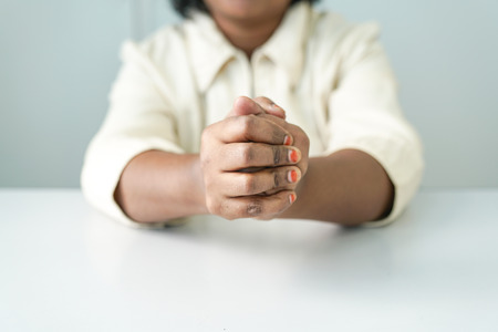 Both hands clasping tightlyの写真素材