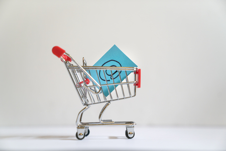 Online shopping concept : Shopping cart or trolley carrying the e-mail symbolの写真素材