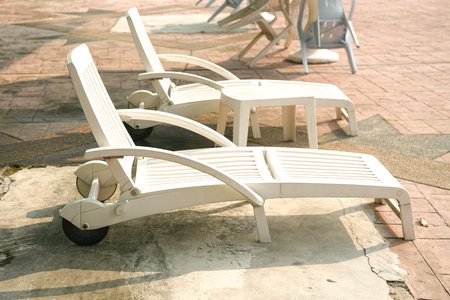 Deck chairs by the pool in a swimming clubの写真素材