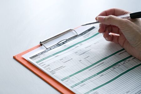 Seeking job concept, filling up the information in an employment application form