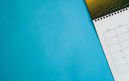 Calendar or planner on grunge or blue background with copy space. Business schedule concept.の写真素材