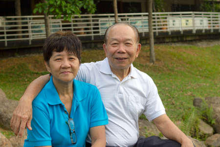 Elderly loving Asian Chinese couple in the park