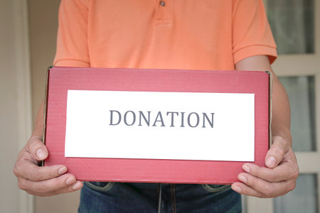 Man holding a Donate box. Donation or charity concept.の写真素材