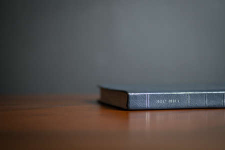 Holy Bible on wood table, with copy space.