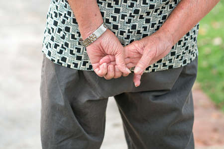 Senior man wrinkled hands, close up view.
