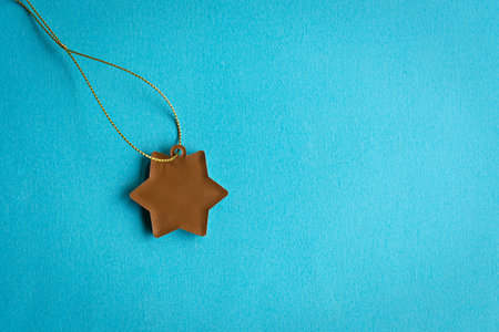 Star shape tag on blue background. Copy space. Template or mockup for text.の写真素材