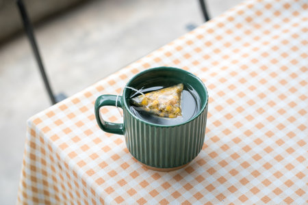 Hot tea in a green cup. High angle view, copy space.の写真素材