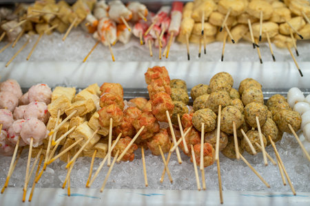 Asian street food, lok lok, meat and seafood on skewers.の写真素材
