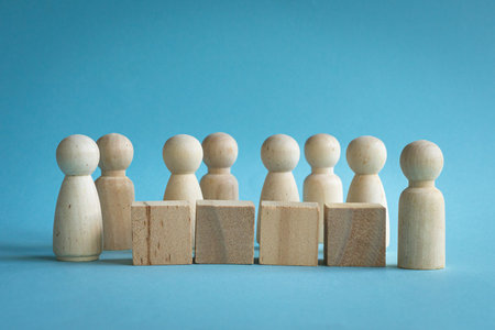 Wooden blocks people and square shape on desk, blue backaground. People in organization concept.の写真素材