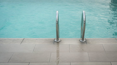 Swimming pool with handrail or grab bar ladder.