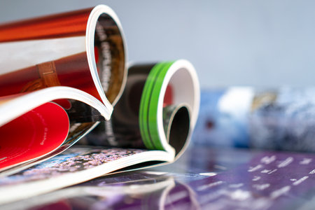 Stack and rolled magazines, copy space.