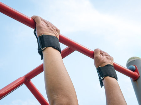 Pull ups workout on the steel bar, close up view.