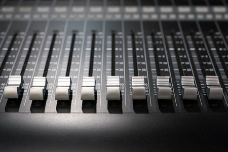 Sound mixer. Professional audio mixing console with buttons, faders and sliders.