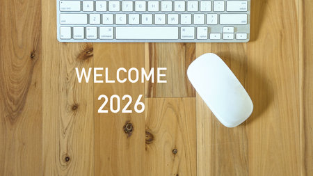 Welcome 2026, next to computer mouse and keyboard. Top view.の写真素材