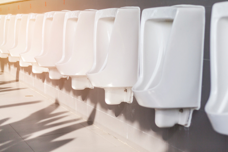 row of outdoor urinals men public toiletの写真素材