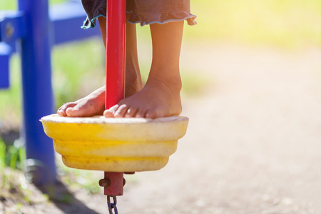 Child's foot climbing on a playgroundの写真素材
