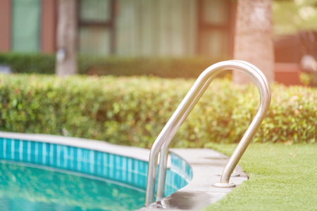 Soft focused picture of Swimming pool with stainless steel stairの写真素材
