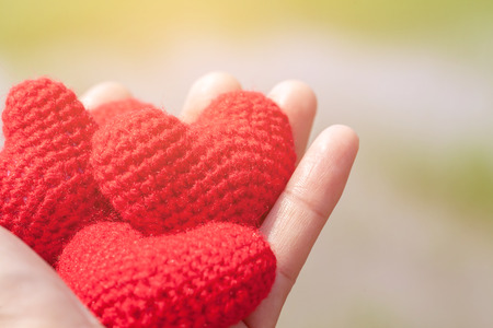 red heart in hand.selective focusの写真素材
