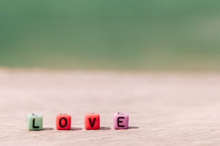 LOVE word on plastic blocks concept of valentine.selective focusの写真素材