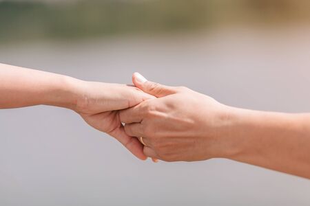 couple holding hands.selective focus.