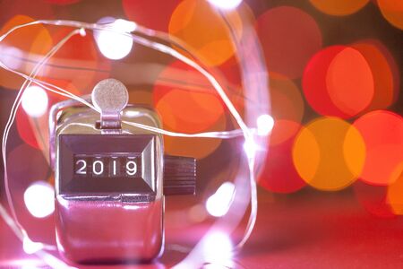 Close up of  number 2019 on reflective background with  bokeh background. Happy new year 2019.の写真素材