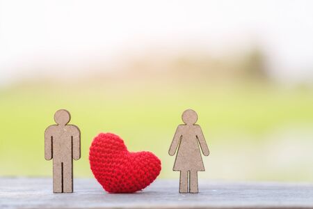 Miniature People Family and red heart on wood background.selective focusの写真素材