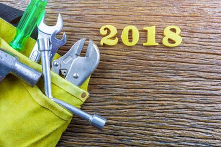 tools and 2018 messages on wood background.selective focus