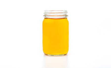 Tea in glass bottles isolated on a white backgroundの写真素材