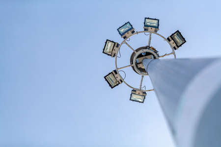 Led  lighting lamp on a pole against the blue skyの写真素材