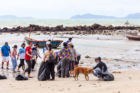 Rayong, Thailand 10 December 2020: Group of volunteers cleaning up beach line at Had Nam Rin.のeditorial素材