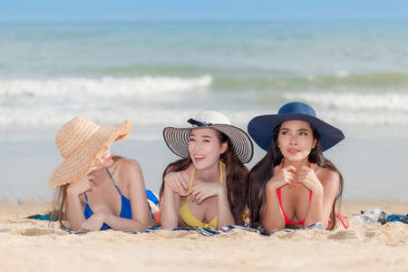 A picture of a group of women having fun on the beach. Summer holidays, travel, vacation concept. Copy space.の写真素材