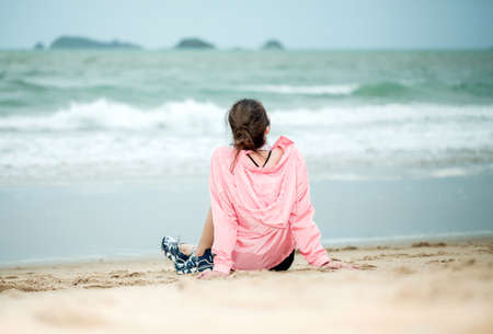 Portrait beautiful young asian women enjoy leisure on the beach sea and ocean at sunset or sunrise for vacation travelの写真素材
