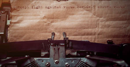 Words 'Concept fight against virus covid-19 corona virus' typed on retro typewriter. Medical and COVID-19 new concept.の写真素材