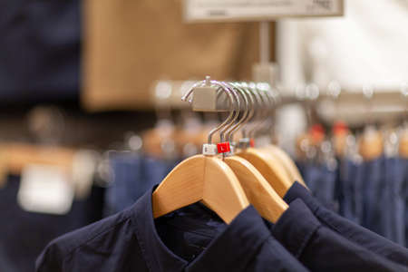 Selective focus winter coats hanged on a clothes rack.の写真素材